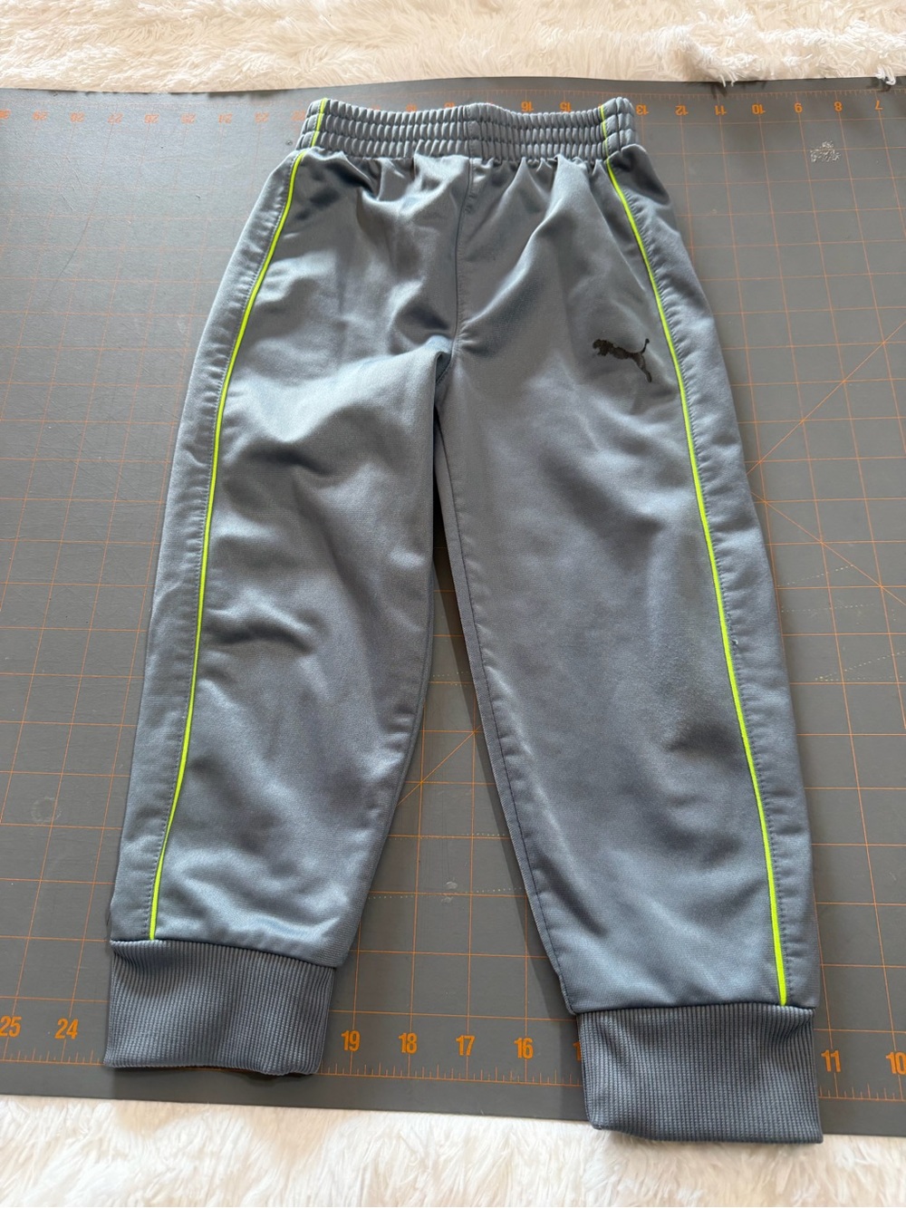 Puma Gray Joggers with Neon Lime Piping 4T has some flaws